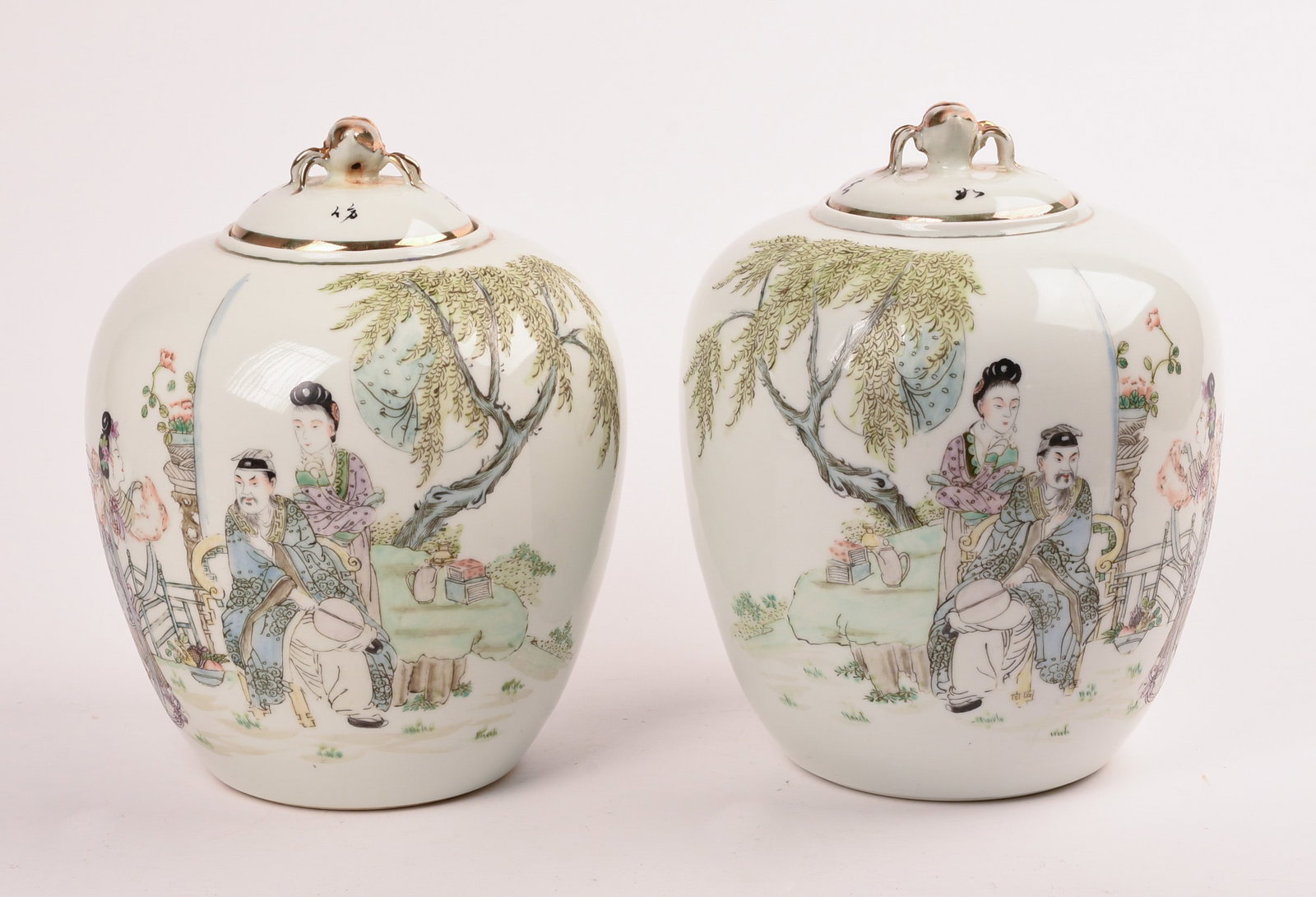 Pair of Chinese Famille Rose Covered Jars: With insect finials. Overall height 8.5 inches.