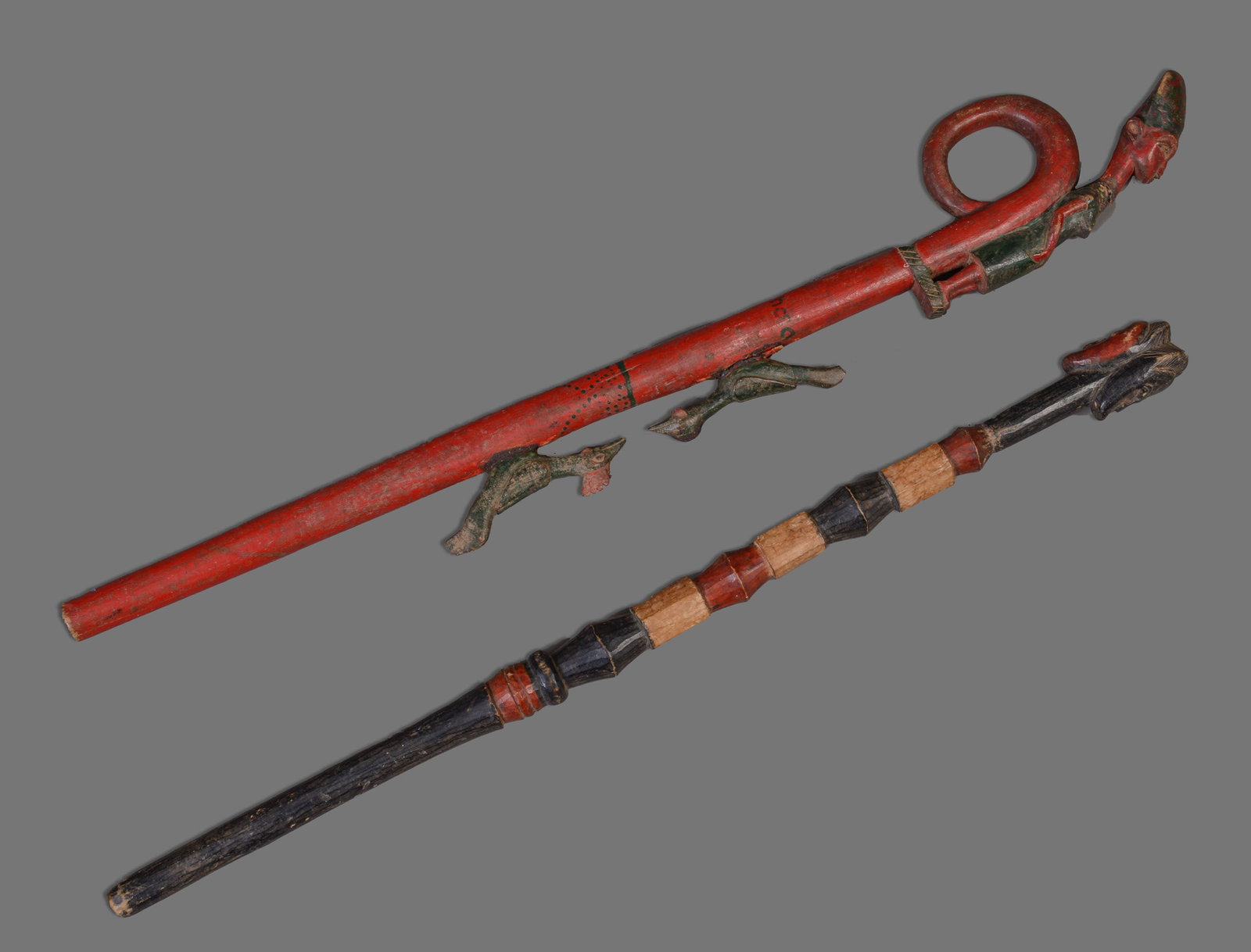 TWO CONGOLESE CHIEFTAIN STAFFS: Length of longest staff 28.5 inches. Repair to one bird, old repair to neck of female figure.