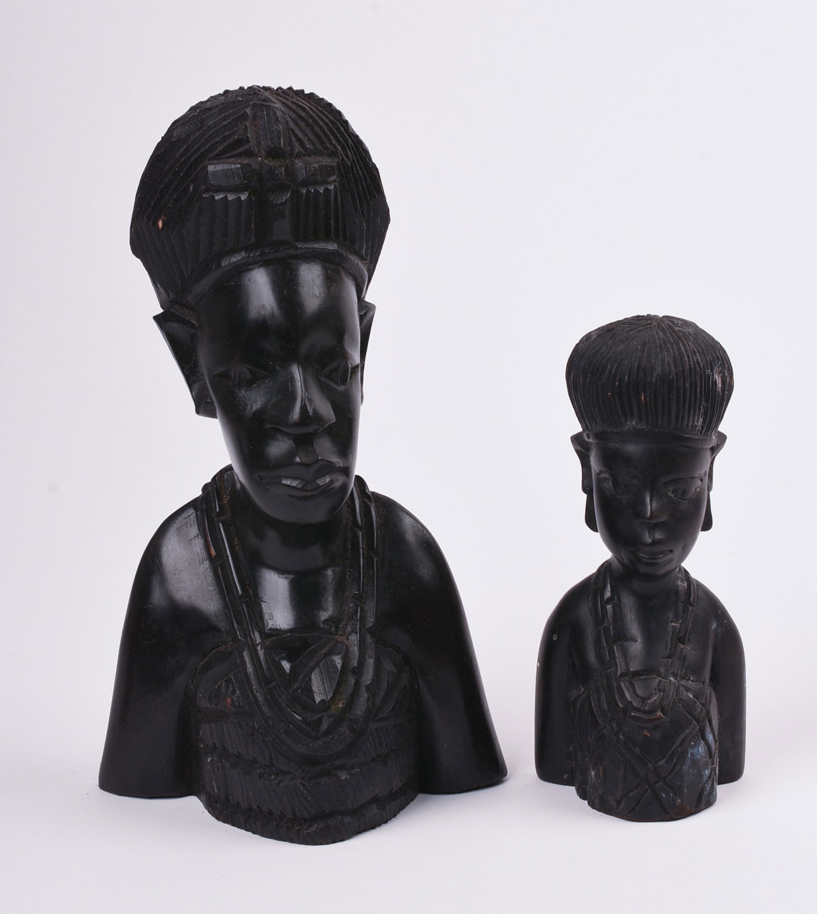 Two African Wood Carved Busts of Women: Height of taller bust 9.75 inches