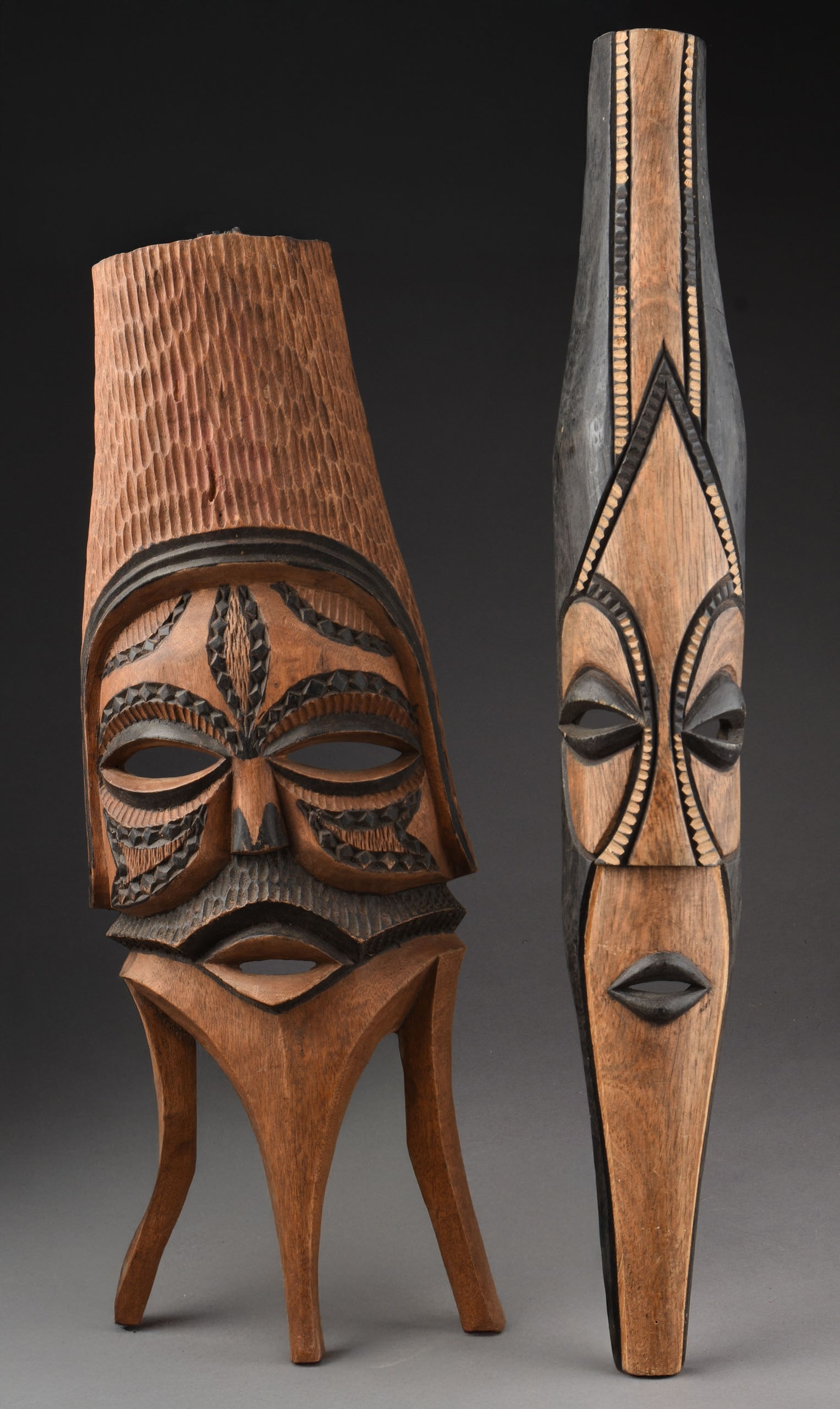 TWO GABON DECORATIVE OBJECTS: Length of longer 24.25 inches.