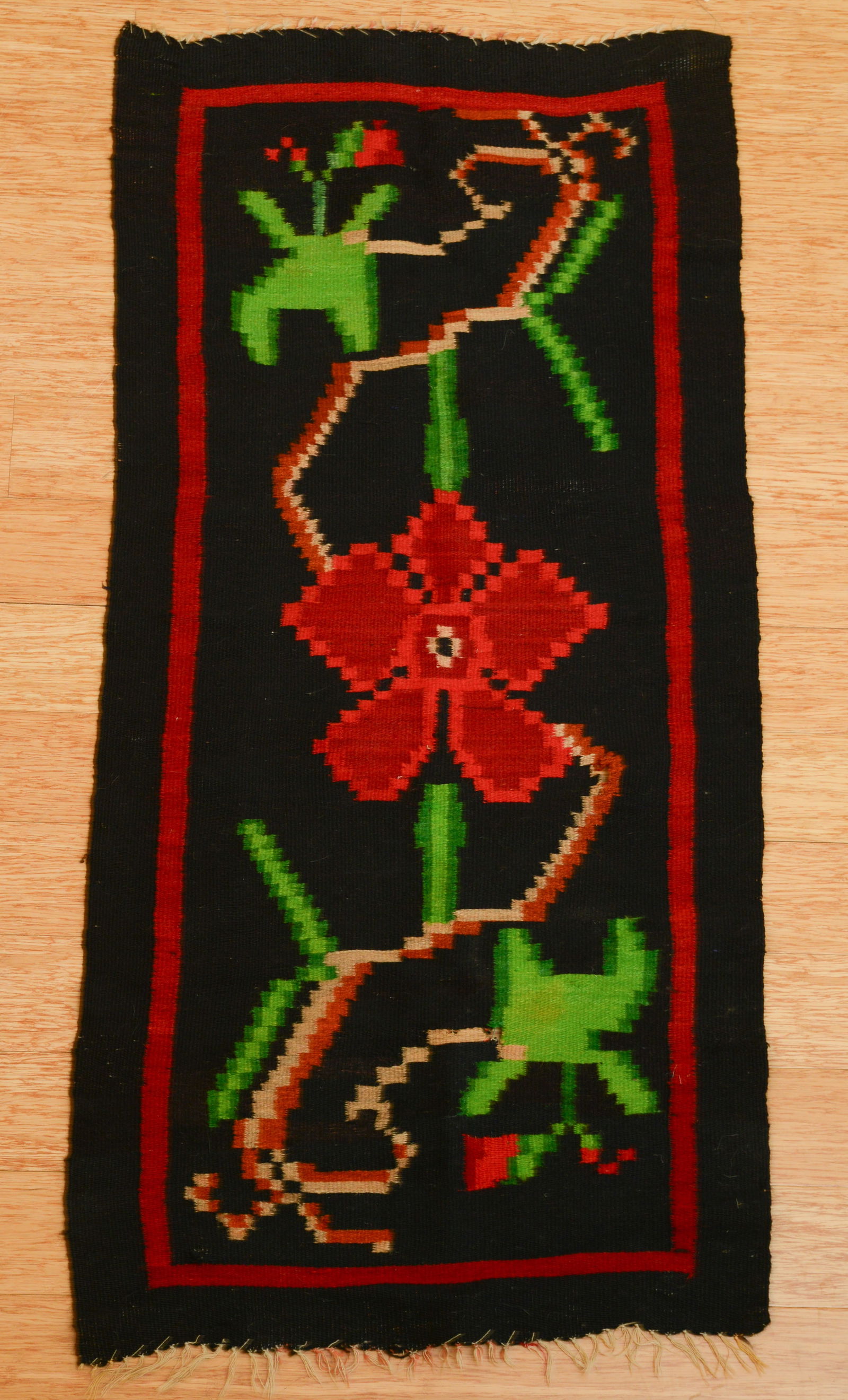 Black Woven Throw Rug with Red Flower (1 of 6)