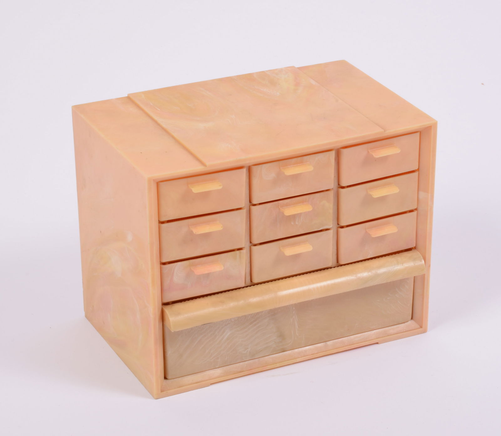 Peach Marbleized Plastic Jewelry Box: With 8 small divided drawers and 1 large drawer, height 7.5 inches