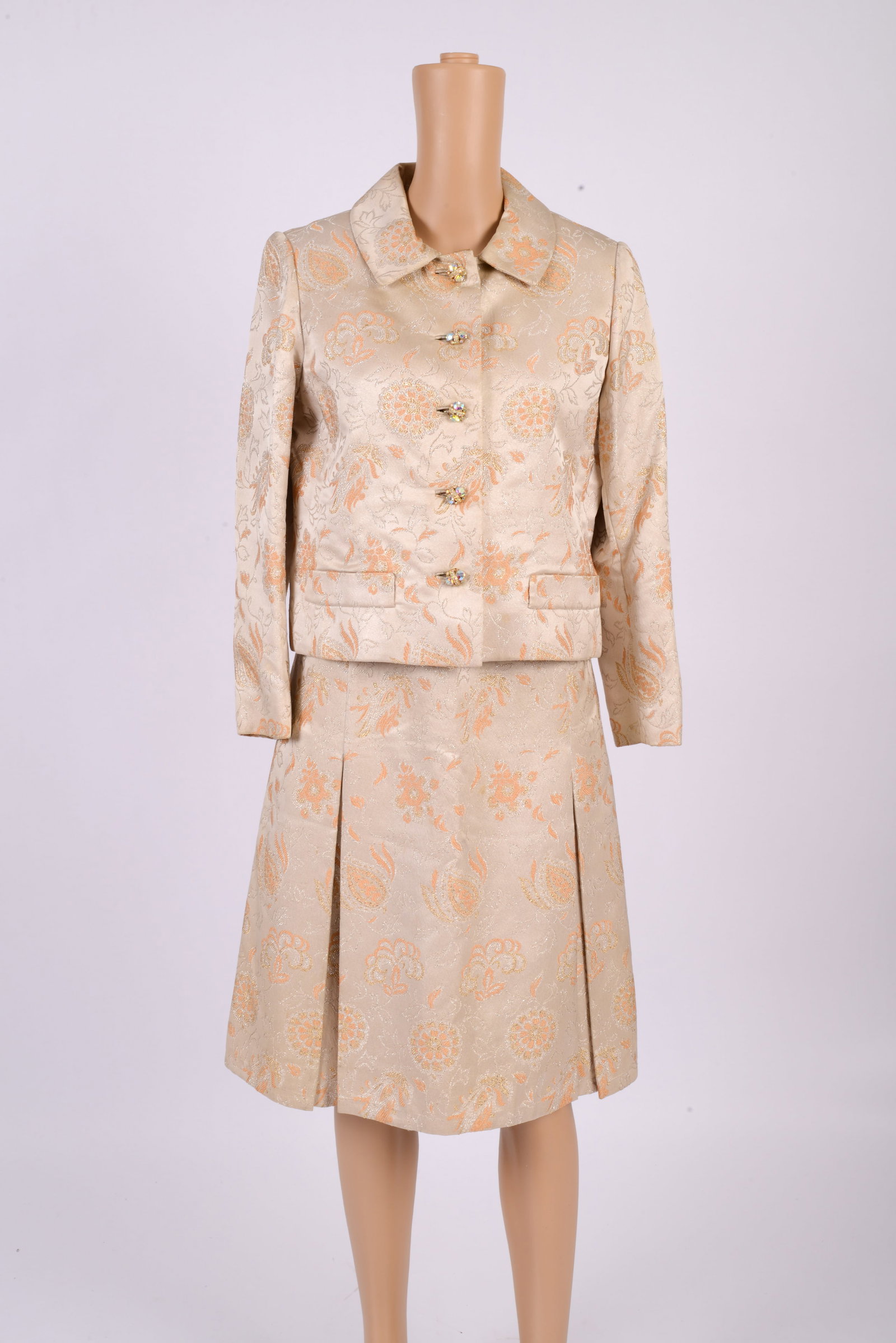 Tan Brocade Sleeveless Dress with Matching Short Jacket: With yellow and gold floral design, dress with matching belt and pleats, length 41.25 inches, good condition.
