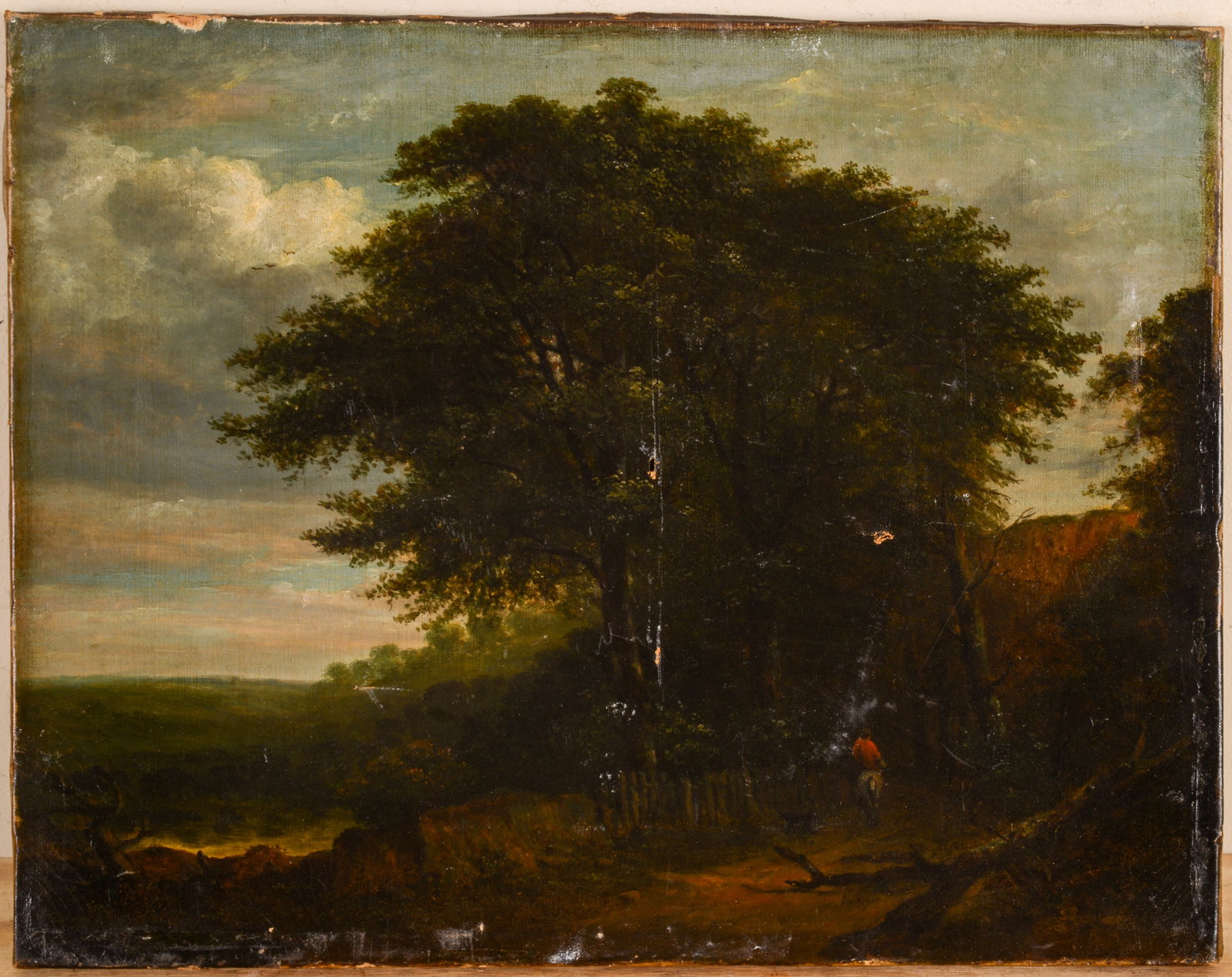 AMERICAN SCHOOL LANDSCAPE WITH A MAN ON HORSEBACK: Unframed, oil on canvas, 14 inches x 18 inches, hole and scratches to canvas
