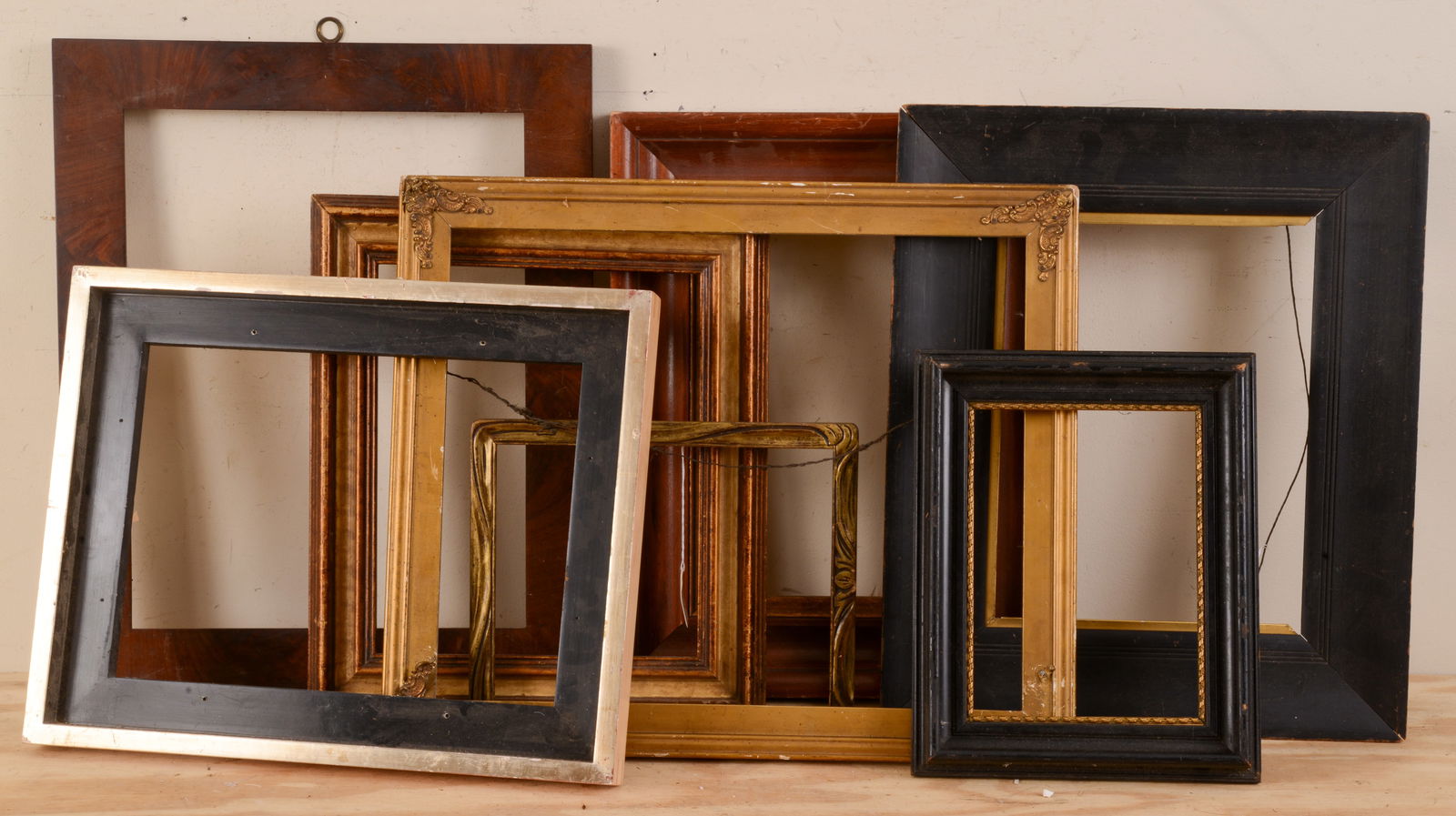 EIGHT ANTIQUE FRAMES.: Various sizes, largest rabbet 12 x 15.5 inches.