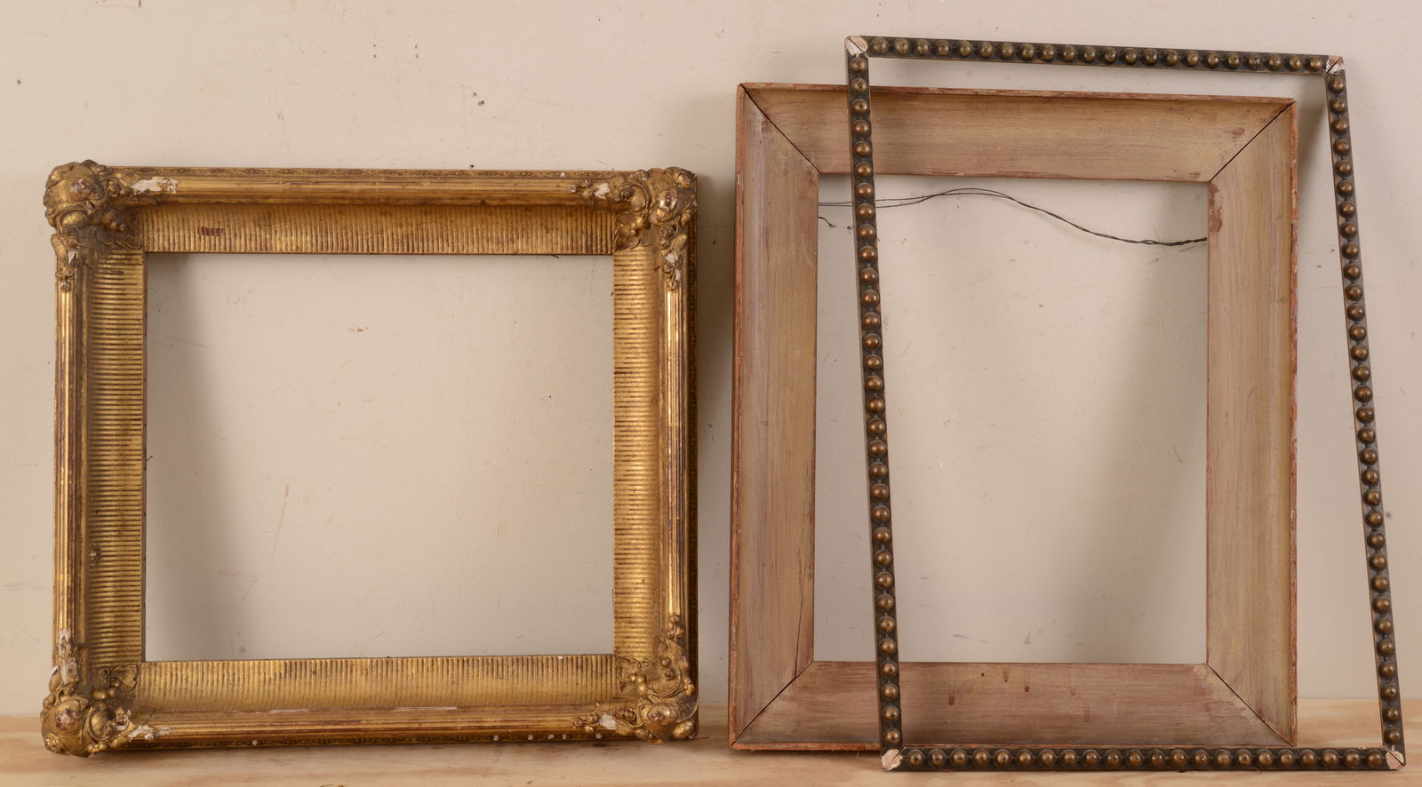 THREE ANTIQUE FRAMES.: Gilt, rabbet 15.5 x 17 inches, and two others. Some losses.