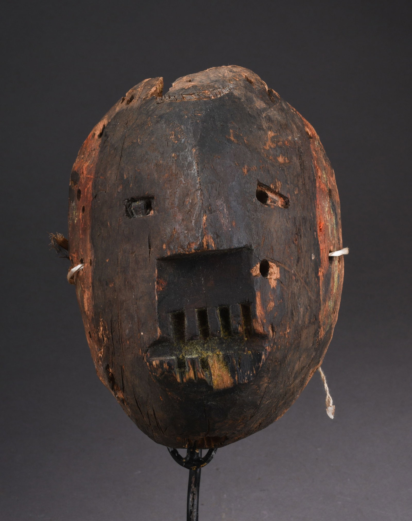 RARE 19TH CENTURY IGBO OSUKWU ANCESTRAL SPIRIT MASK: Length 7.5 inches. Some loss (see photos). Osukwu ancestor's spirit. Isu Village, Oba-Idemili, Igbo Tribe Nigeria Osukwu was a powerful spirit mask belonging to a secret society members members of thi