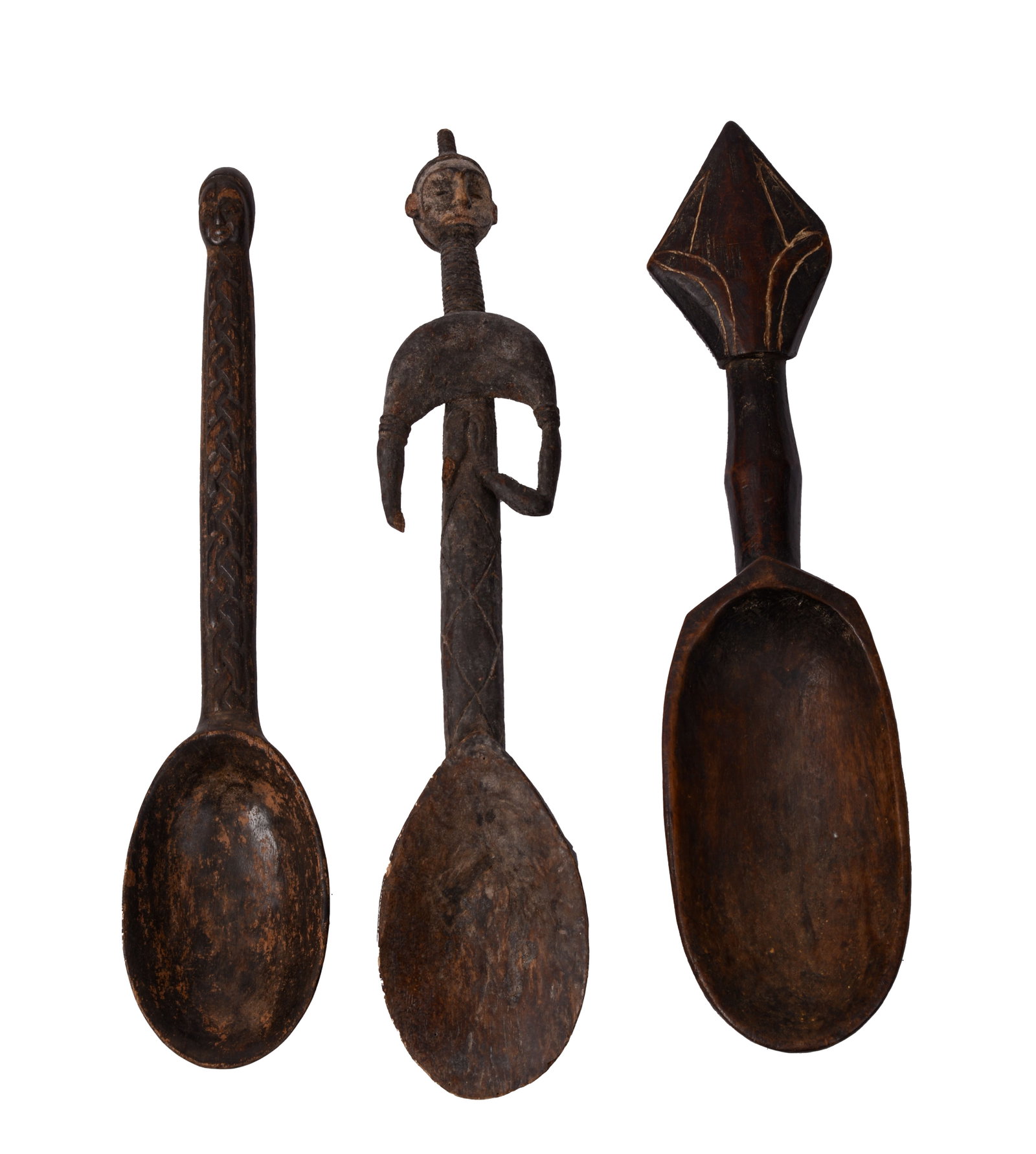THREE AFRICAN CARVED SPOONS.: Lengths 17 and 18 inches.
