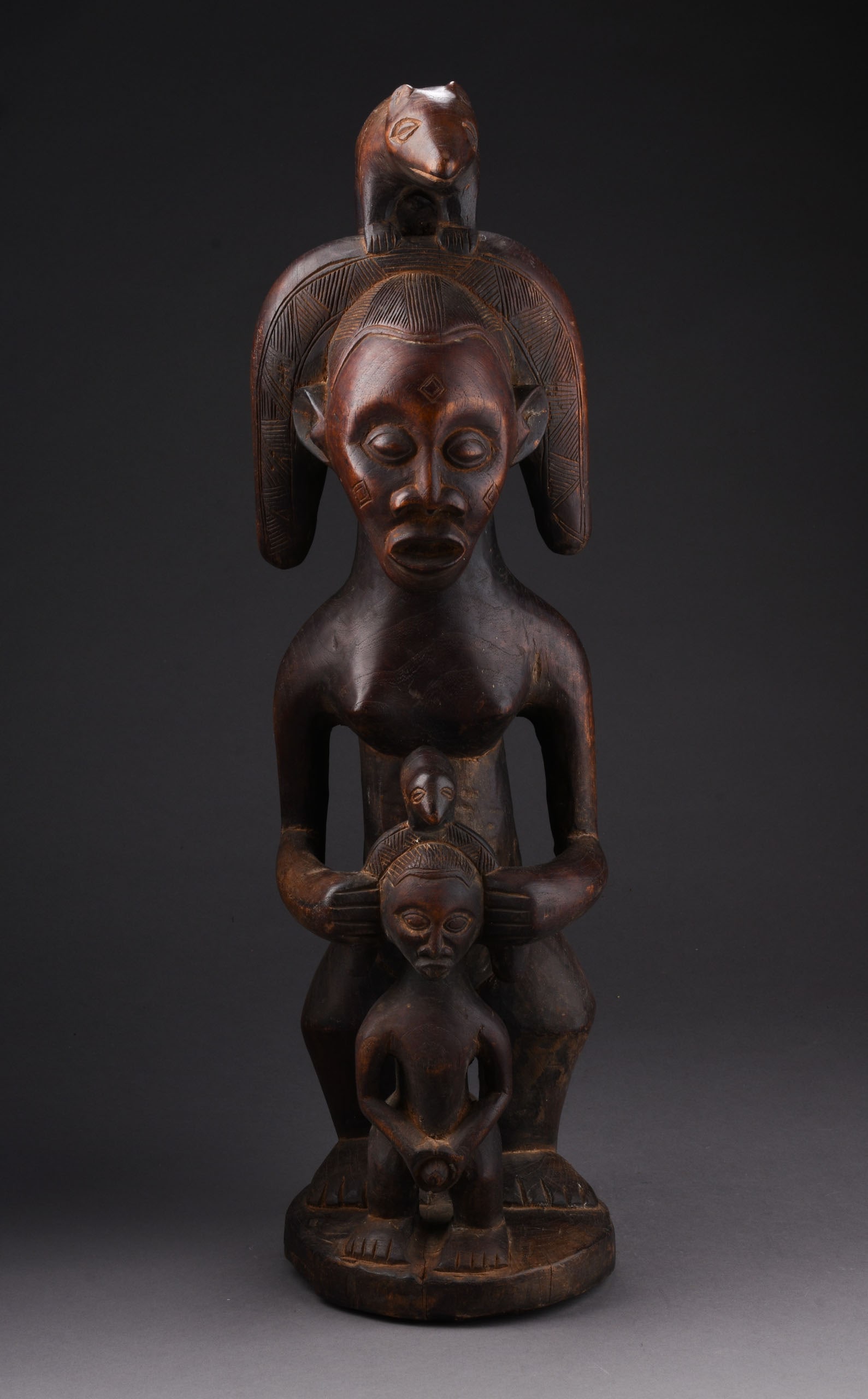 BAULE IVORY COAST MATERNAL FIGURE: Height 22.5 inches. Some cracks, otherwise good condition.