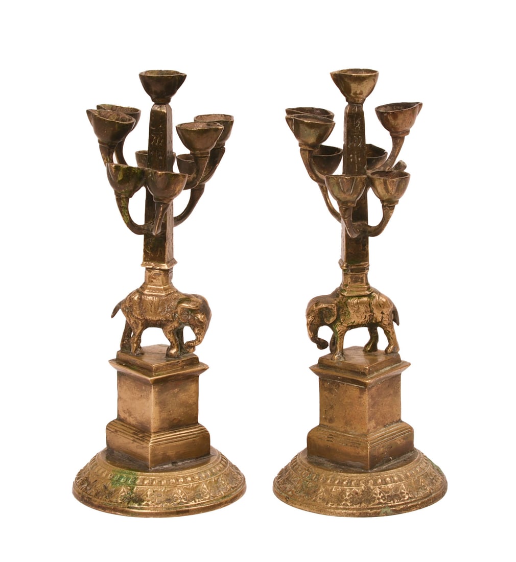 PAIR OF BRONZE MENORAH.: Elephants supporting obelisks, modeled after Bernini’s Elephant and Obelisk, Grand Tour. Height 9 inches. One is missing one cup.