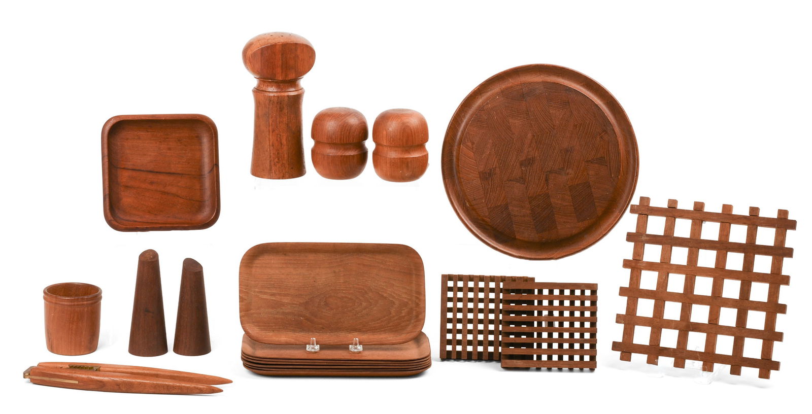 Group of Scandinavian Modern Teak Table Accessories.: Including a nutcracker marked Denmark, a Digsmed cheese board, a trivet, two coasters, a pepper grinder, two pair of salt and pepper shakers, seven snack trays, a signed Norwegian cup, and a signed No