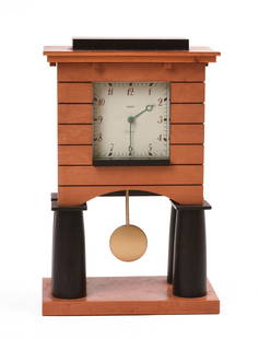 Michael Graves Mantel Clock for Alessi.: Postmodern architectural design, bird’s-eye maple veneer and black lacquered wood. Signed on clock face and on label on underside of lid, 1986. Height 9.75 inches.