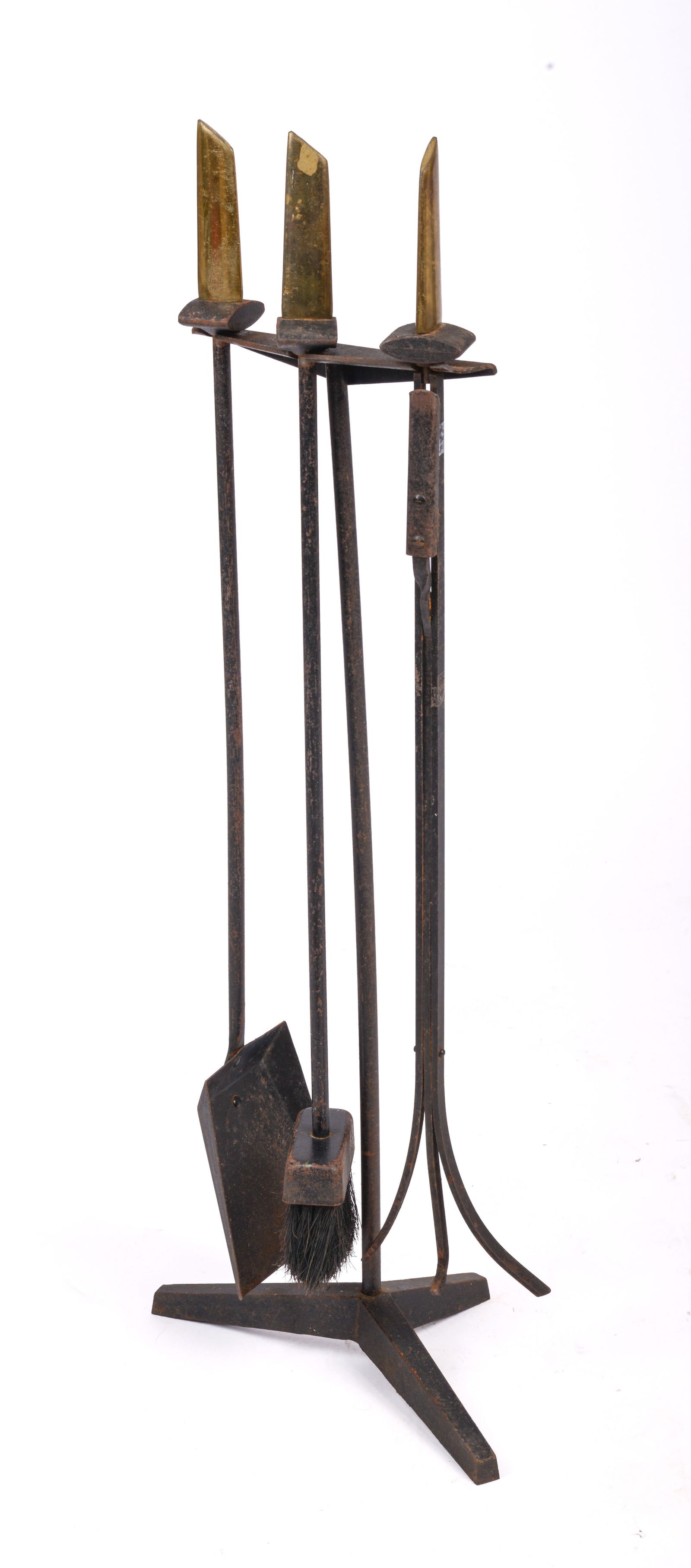 Donald Deskey Fire Tools.: Designed for Bennett, iron with brass handles, missing brass glides on feet, surface rust. Height 34 inches.