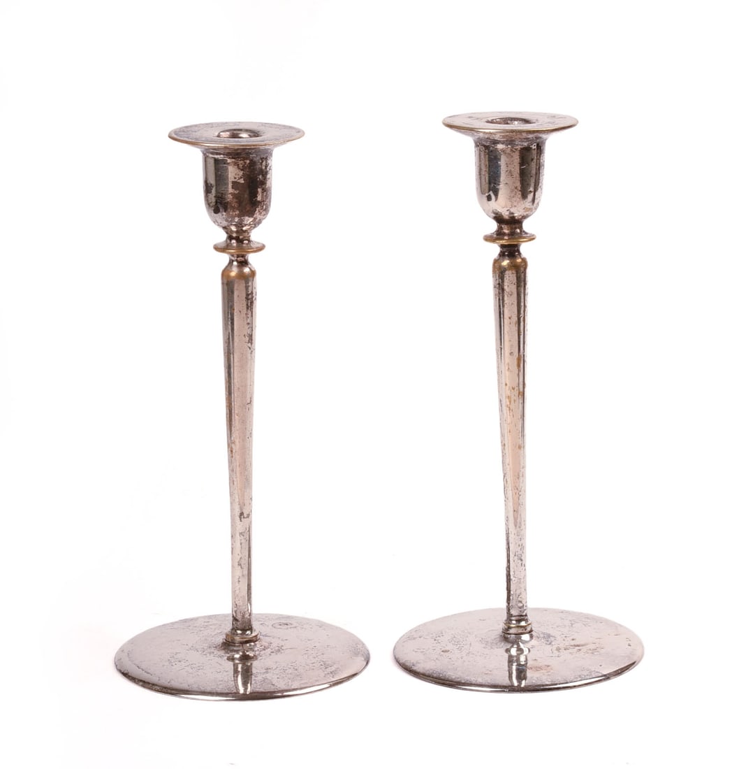 Pair of Arts and Crafts Disc Base Candleholders.: Silver-plate. Height 9.75 inches.
