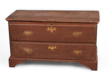 New England Pine Blanket Chest in Red Paint.: Height 21 inches, width 38.5 inches, depth 18 inches. Includes a collection of vintage and early clothing. One leg with repaired break, some overall surface wear. SHIPPING: We offer very