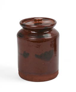 New England Redware Covered Jar.: 19th c. The lid a later addition. Height 6.5 inches. Chips to lid, jar in good condition. SHIPPING: We offer very competitively priced in house shipping for all items in this sale. Please contac