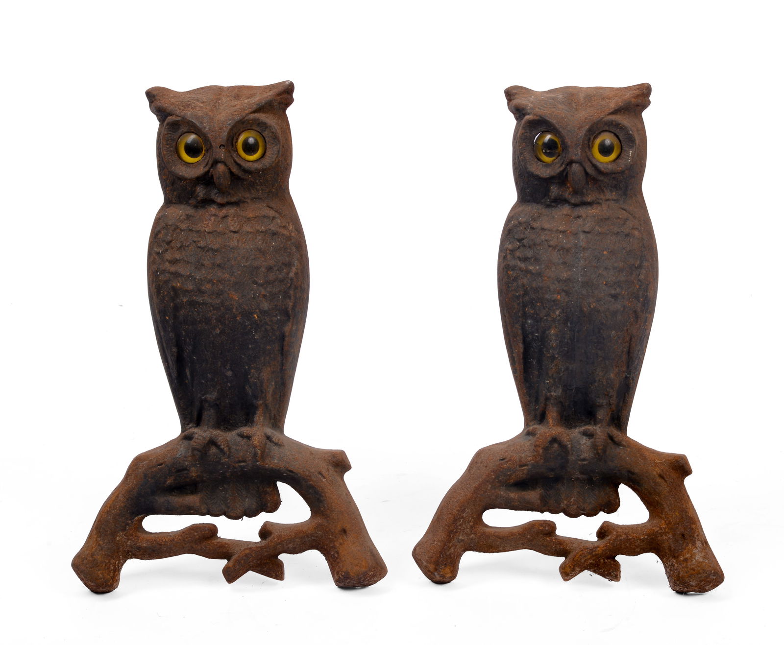 Pair of Cast Iron Owl Andirons With Glass Eyes.: Height 16 inches. Log jambs cut off. SHIPPING: We offer very competitively priced in house shipping for all items in this sale. Please contact us for a quote.