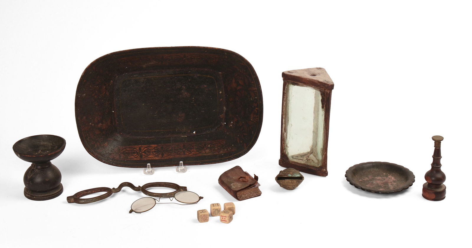 Collection of Early Table Objects.: Tole tray, bone dice, eye glasses, glasses mold, miniature cards, brass bell, seal, and others. Tray 12.5 x 8 inches. All with some age related wear. SHIPPING: We offer very competitively priced in ho