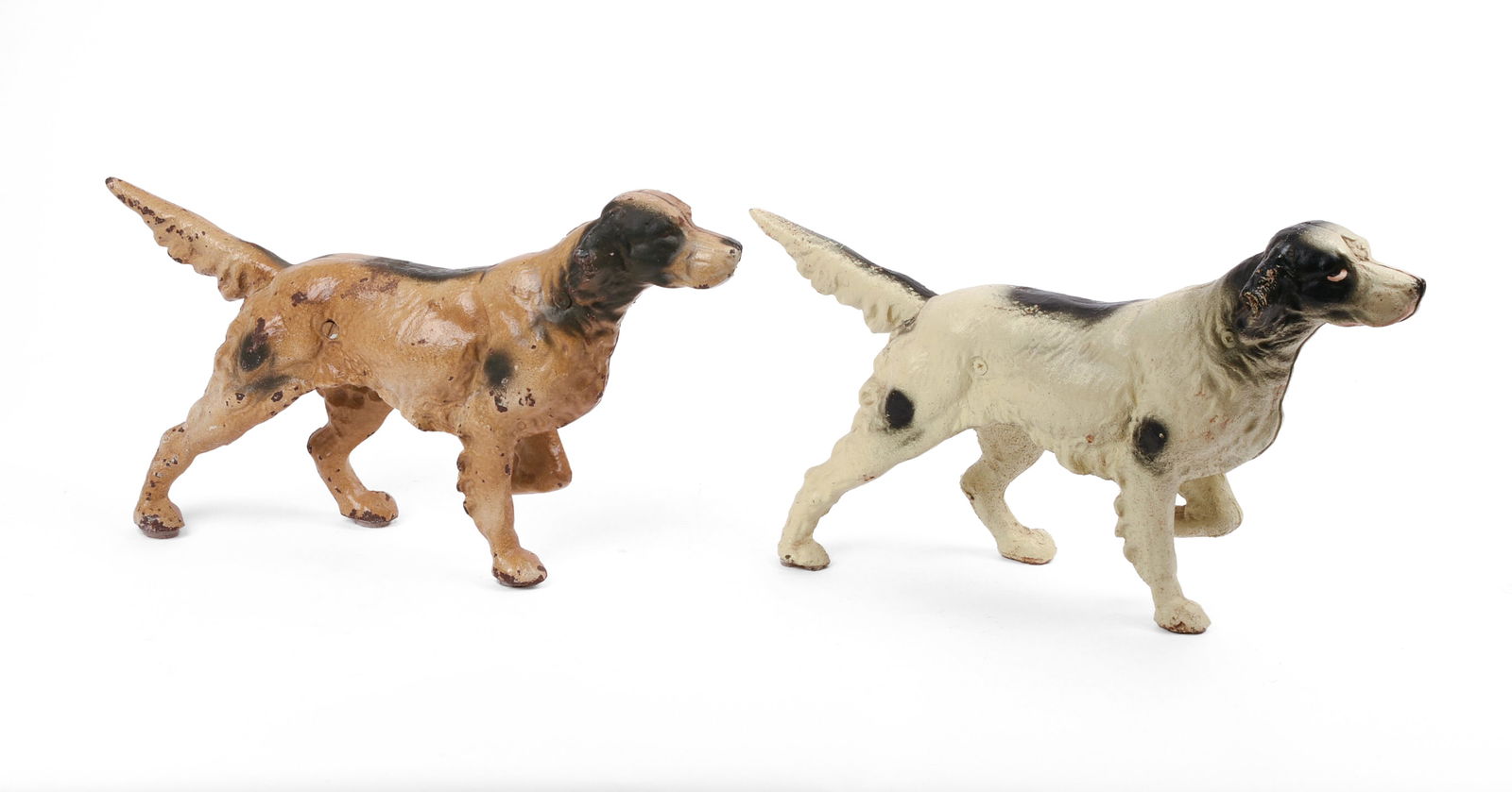 Two Cast Iron Irish Setter Doorstops.: Lengths 15 inches, height 9 inches. Some paint loss. SHIPPING: We offer very competitively priced in house shipping for all items in this sale. Please contact us for a quote.