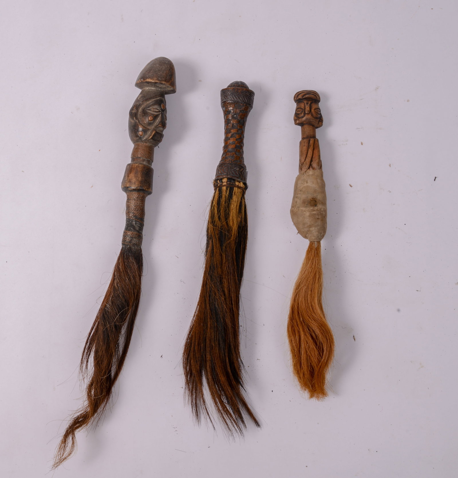 Three African Brushes.: Lengths 14, 16, and 18 inches. SHIPPING: We offer very competitively priced in house shipping for all items in this sale. Please contact us for a quote.