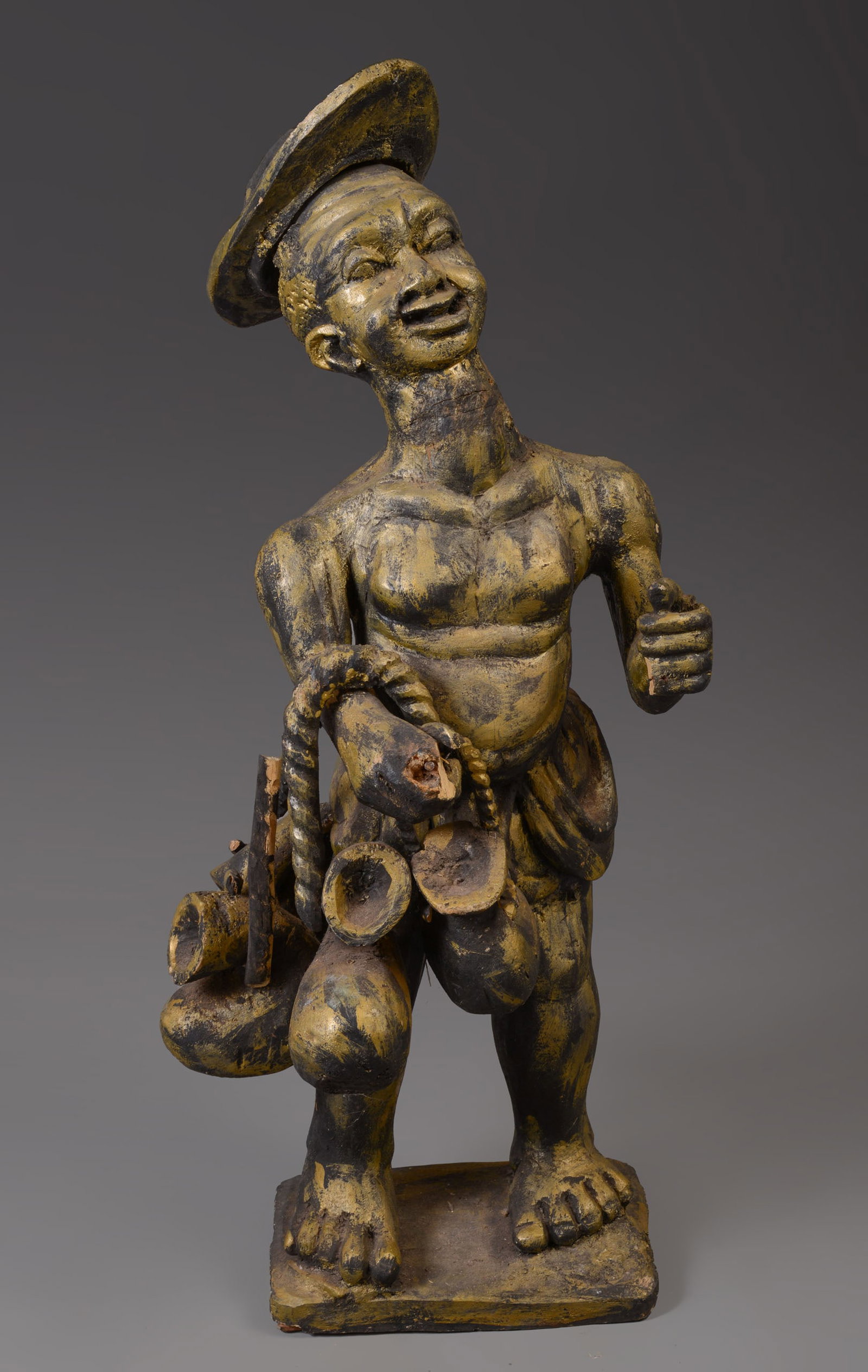 Palm Wine Tapper Figure.: The statue was designed to depict an energy source for attracting merriment and celebration of happiness. Palm wine is symbolic in all aspects of important ceremonies in Africa; no important gathering