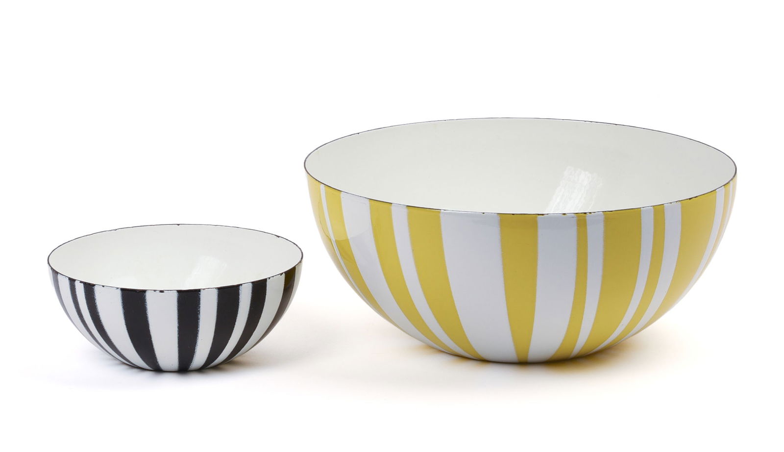 Two Cathrineholm Stripes Enamel Bowls.: Designed by Grete Prytz Kittelsen, Norway, 1960’s. Height of larger 4 1/8 inches, diameter 9.5 inches. Some wear to rims and light scratches inside of bowls with use. IN HOUSE SHIPPING: We offer ver