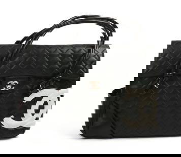 Chanel Black Leather Purse.: Quilted stitching and white leather logo. With Gucci dust bag. Height 10 1/4 inches, width 13 1/2 inches. Minor wear, good condition. IN HOUSE SHIPPING: We offer very competitively priced in house shi