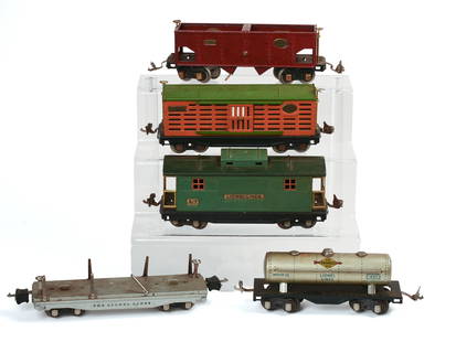 Five Lionel O Gauge Train Cars.: 817 Caboose, 816 Coal Car, 1680 Sunoco Gas, 811 Stake Car, 813 Box Car. Good condition, stake car lacking two stakes, one connector loose. IN HOUSE SHIPPING: We offer very competitively priced in hous