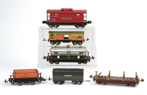 Six Lionel O Gauge Train Cars.: 1679 Box Car, 1688W Whistle Tender, 811 Stake Car, 2817 Caboose, 815 Tank Car, 809 Dump Car. Good condition. IN HOUSE SHIPPING: We offer very competitively priced in house shipping for all items in th