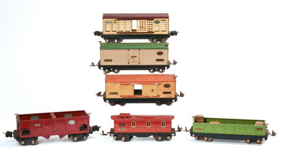 Six Lionel O Gauge Train Cars.: 814 box car, 2813 stock car, 812 gondola, 1682 caboose, 2815 coal car, 814R box car. Good condition, some surface scratches. IN HOUSE SHIPPING: We offer very competitively priced in house shipping for