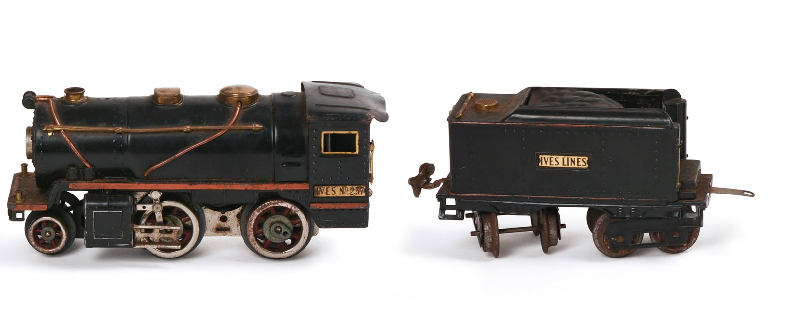 Ives 257 Steam Locomotive and Tender.: One side rail loose, some surface scratches. IN HOUSE SHIPPING: We offer very competitively priced in house shipping for all items in this sale. Please contact us for a quote.