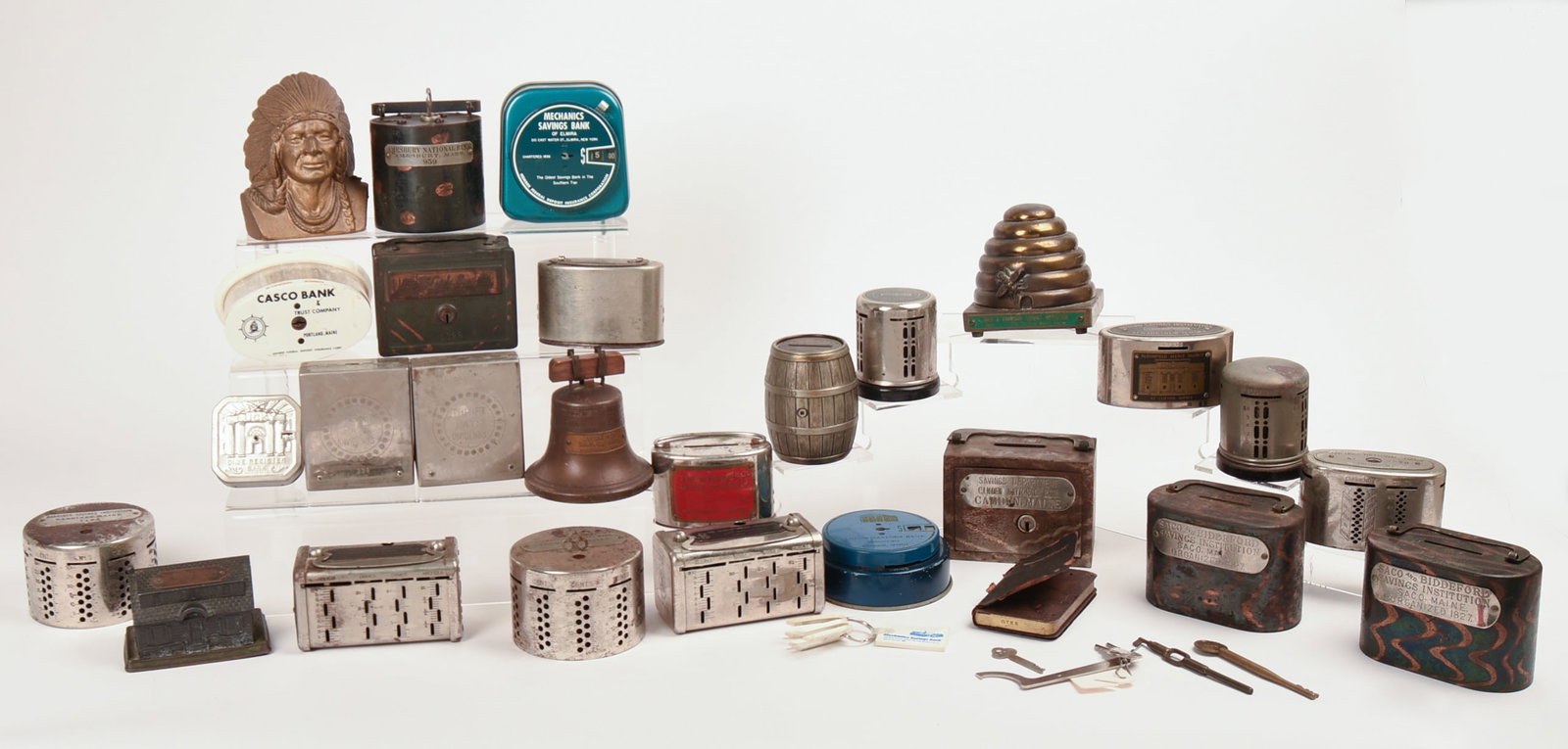 Extensive Collection of Coin Banks.: Mostly Maine, Including Millinocket Trust Co, Bangor Savings, Mechanic Savings Bank, Saco and Biddeford Savings Institute, Gardiner Savings, and others. 27 pieces. IN HOUSE SHIPPING: We offer very com