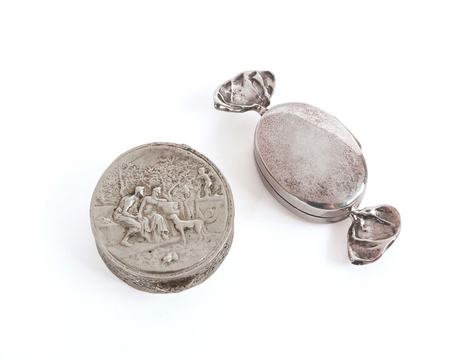 Two Sterling Silver Pill Boxes.: One in the form of a hard candy, length 2 inches, the other marked Italy. IN HOUSE SHIPPING: We offer very competitively priced in house shipping for all items in this sale. Please contact us for a qu