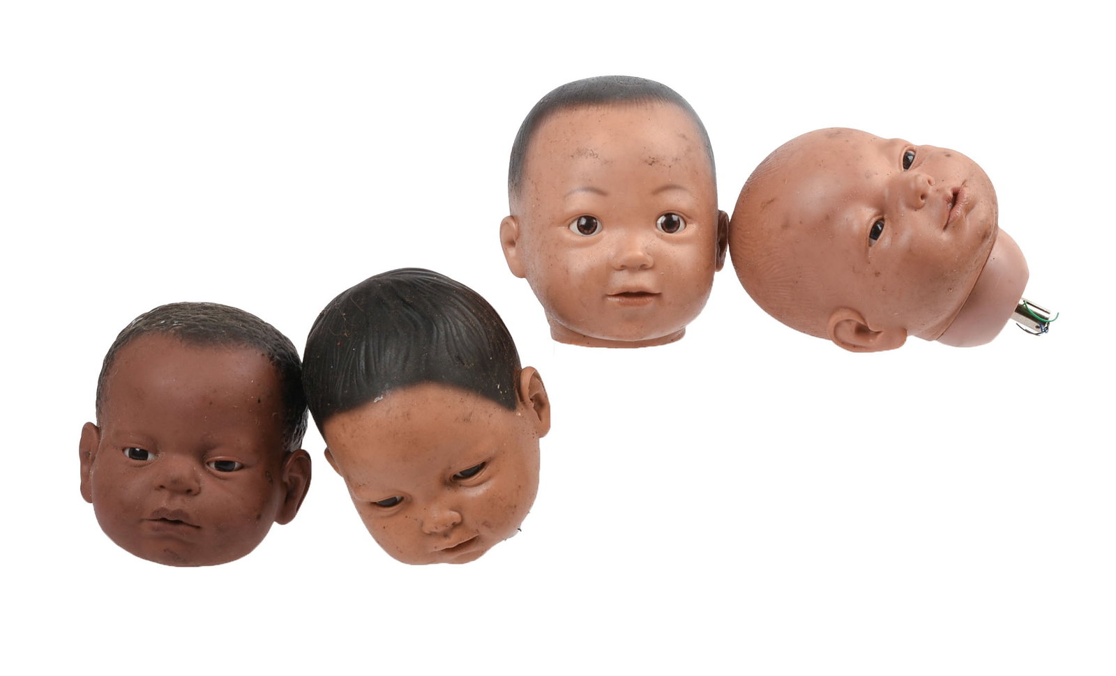 Four Automaton Doll Heads: Heights 5 inches. IN HOUSE SHIPPING: We offer very competitively priced in house shipping for all items in this sale. Please contact us for a quote.