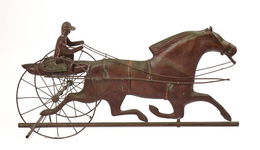 COPPER HORSE AND SULKY WEATHERVANE.: Early 20th century. Length 31 inches. Some minor losses. IN HOUSE SHIPPING: We offer very competitively priced in house shipping for all items in this sale. Please contact us for a quote.