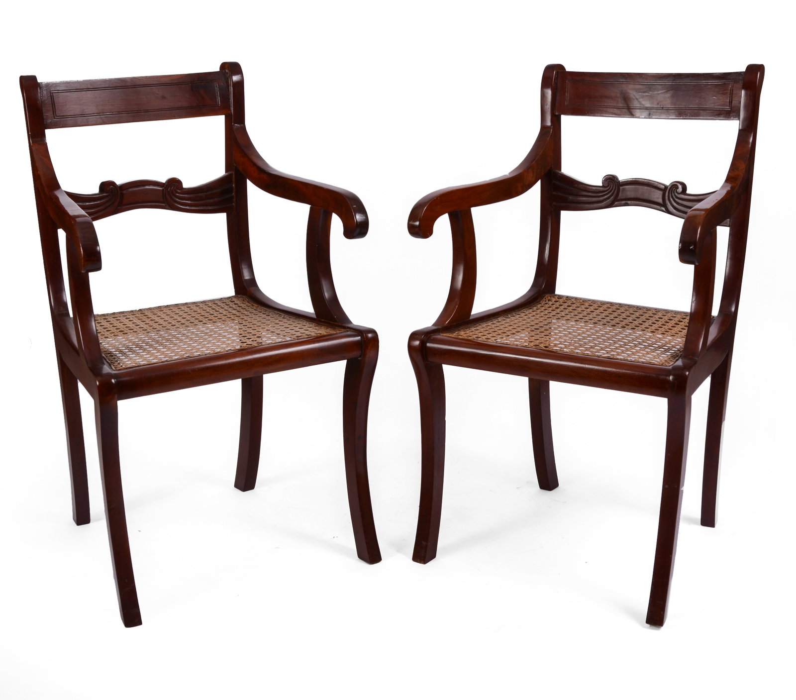 PAIR OF CARIBBEAN CEDAR ARMCHAIRS WITH CANE SEATS.: Seat height 18 inches, overall height 37.5 inches. IN HOUSE SHIPPING: We offer very competitively priced in house shipping for all items in this sale. Please contact us for a quote.