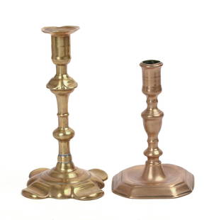 TWO 18TH OR EARLY 19TH CENTURY BRASS CANDLESTICKS.: A Queen Anne example, height 8.75 inches, and one with a square base, height 7 inches. IN HOUSE SHIPPING: We offer very competitively priced in house shipping for all items in this sale. Please contac