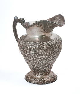 STIEFF STERLING SILVER AESTHETIC MOVEMENT PITCHER.: Height 9.5 inches, 932 grams. A few small dents. IN HOUSE SHIPPING: We offer very competitively priced in house shipping for all items in this sale. Please contact us for a quote.