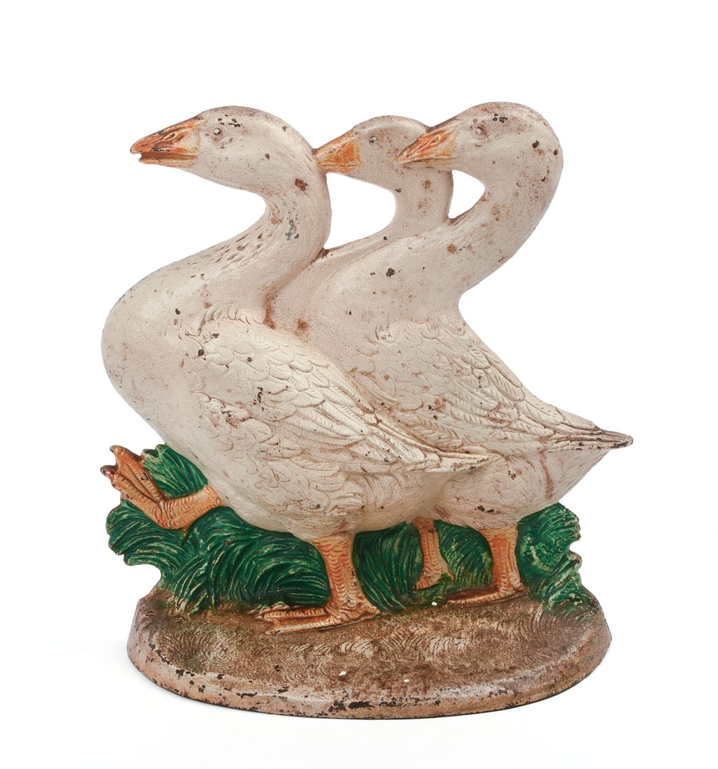 CAST IRON GEESE WALKING DOORSTOP.: Stamped "457" on back. Height 8.25 inches, width 7.5 inches. Paint chipping. IN HOUSE SHIPPING: We offer very competitively priced in house shipping for all items in this sale. Please contact us for a