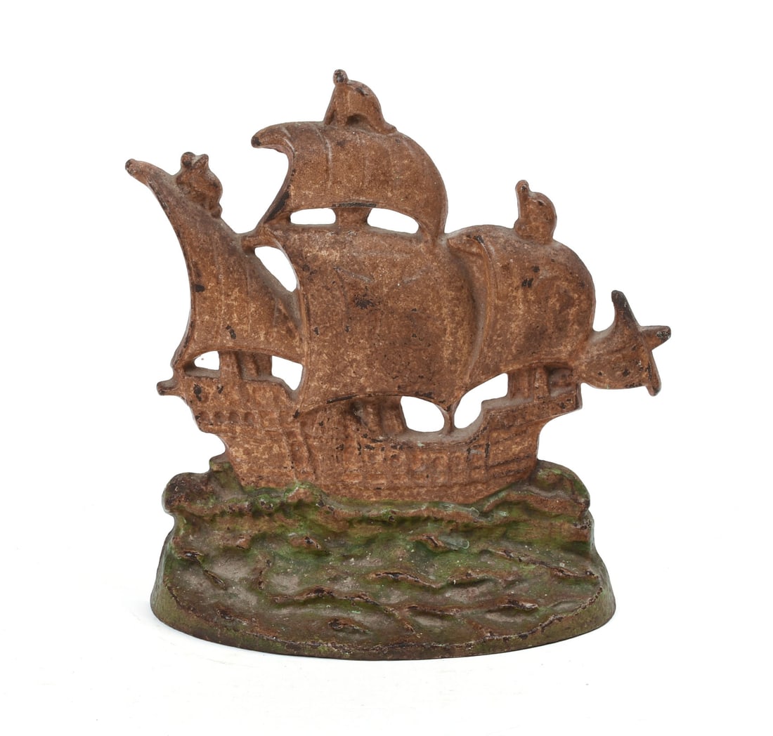 CAST IRON SHIP FORM DOORSTOP.: Height 8.5 inches. IN HOUSE SHIPPING: We offer very competitively priced in house shipping for all items in this sale. Please contact us for a quote.