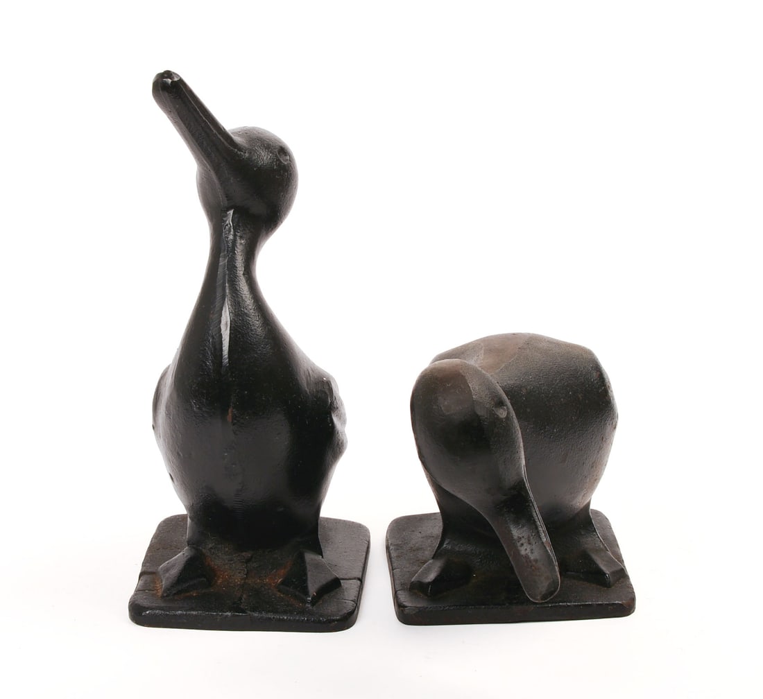 TWO CAST IRON DUCK DOORSTOPS.: Black paint. Height of taller 11.5 inches, width 9 inches. IN HOUSE SHIPPING: We offer very competitively priced in house shipping for all items in this sale. Please contact us for a quote.