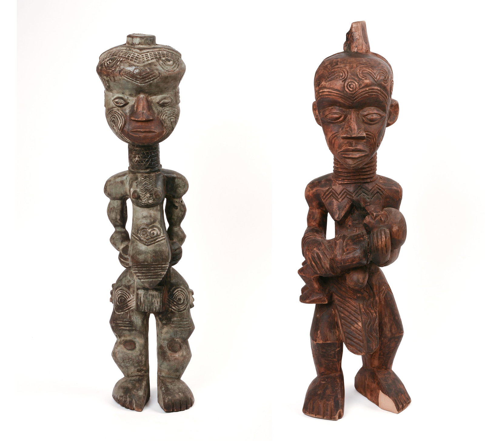 TWO AFRICAN CARVED WOODEN FIGURES.: Heights 26 and 27 inches. Taller with loss to one foot.