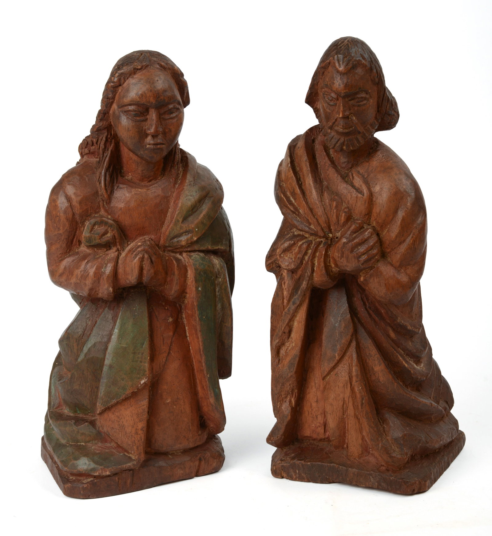 AFRICAN CARVED WOODEN FIGURES OF JOSEPH AND MARY.: Heights 12 inches. Good condition.