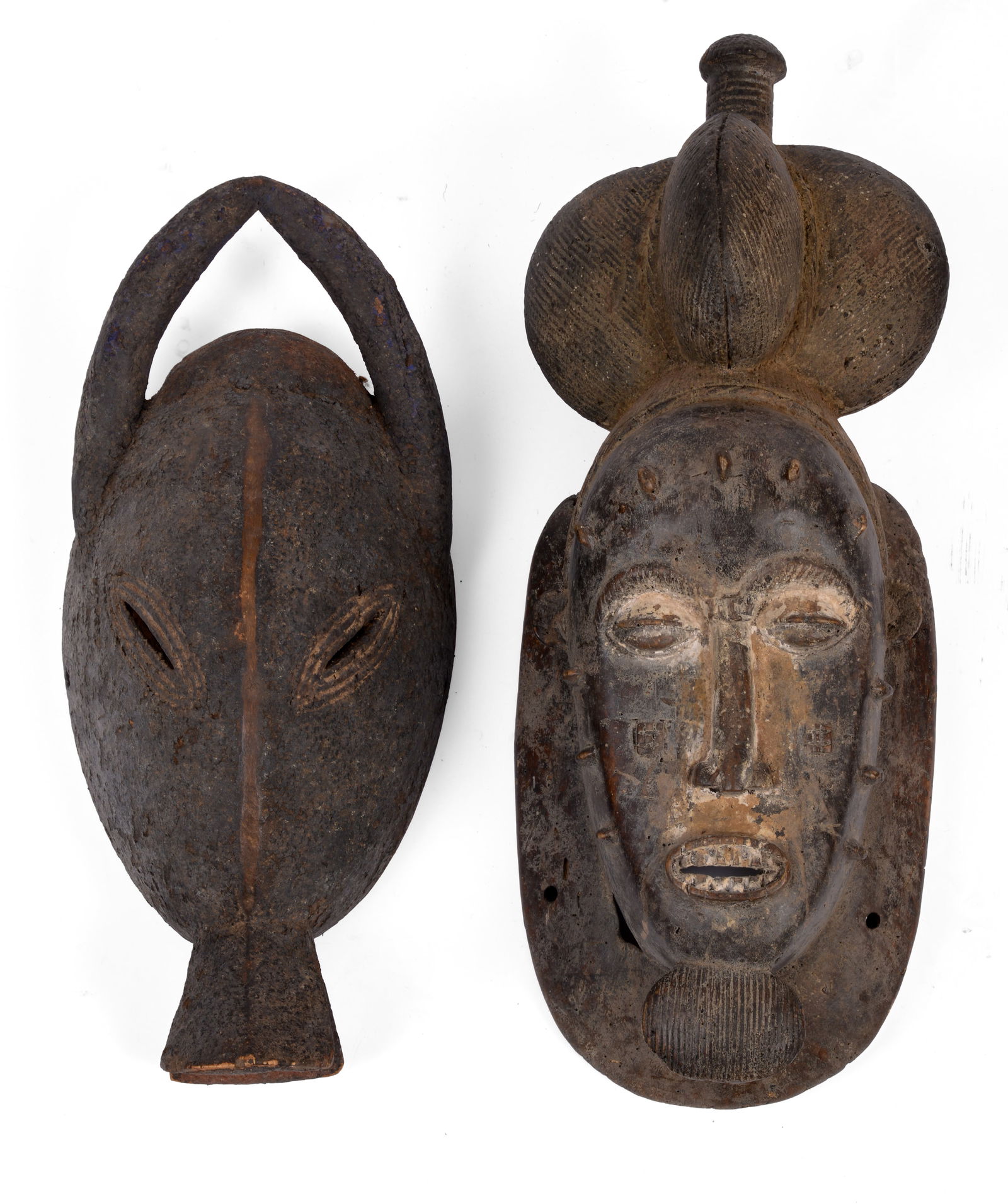 TWO AFRICAN CARVED WOODEN MASKS. (1 of 3)