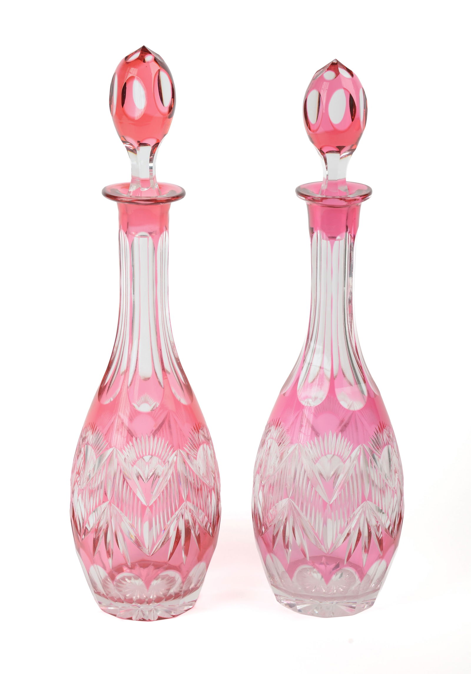 PAIR OF CUT OVERLAY GLASS DECANTERS. (1 of 5)