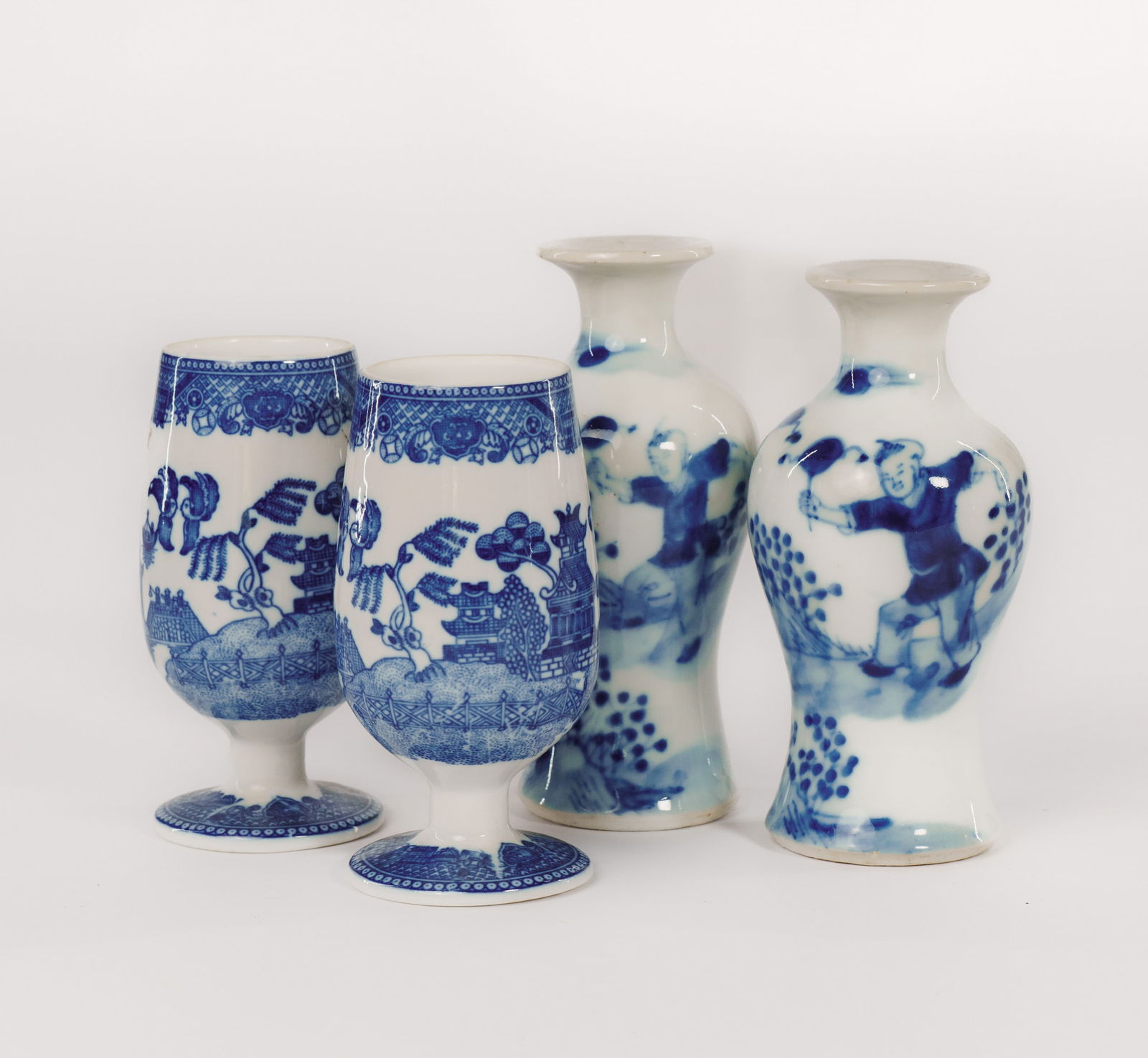 Pair of Chinese Blue and White Small Vases and a Pair of Blue Willow Egg Cups.: Height of vases 4 inches. Small rim chip to one vase.