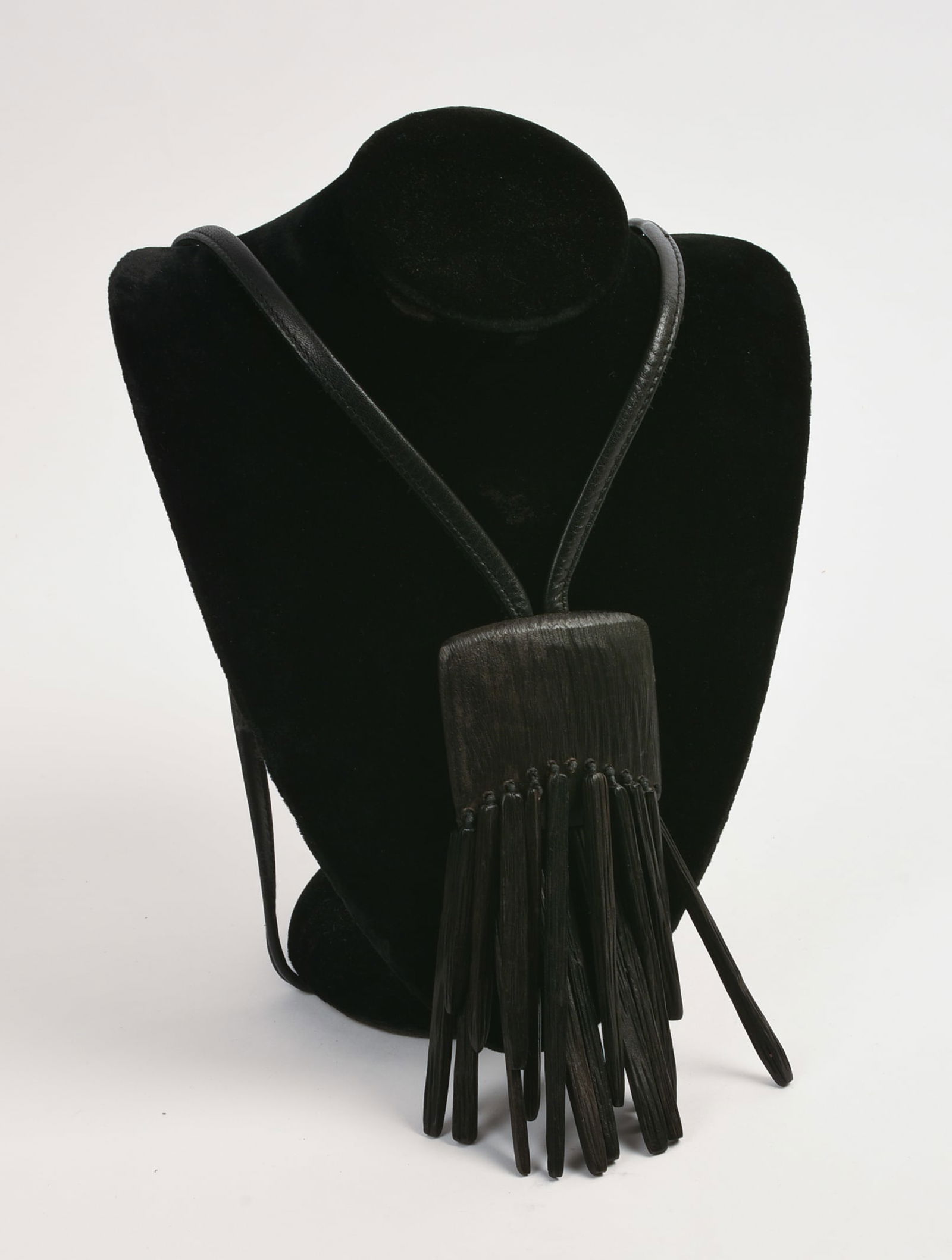 GERDA LYNGGAARD FOR MONIES LARGE KAMAGONG WOOD FRINGE NECKLACE: Pendant 6 x 2.5 inches, leather necklace length 19 inches. Missing one piece of fringe.