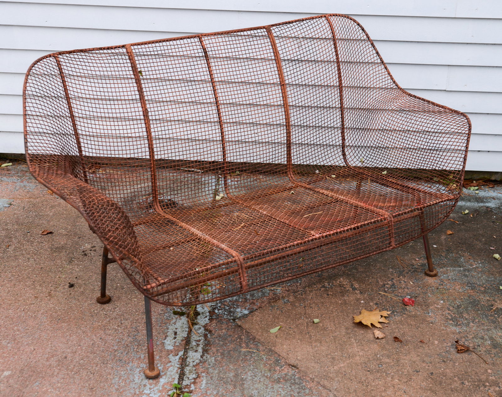 RUSSELL WOODARD SCULPTURA METAL BENCH.: Length 53 inches, height 29 inches, seat height 13 inches. Rusted finish.