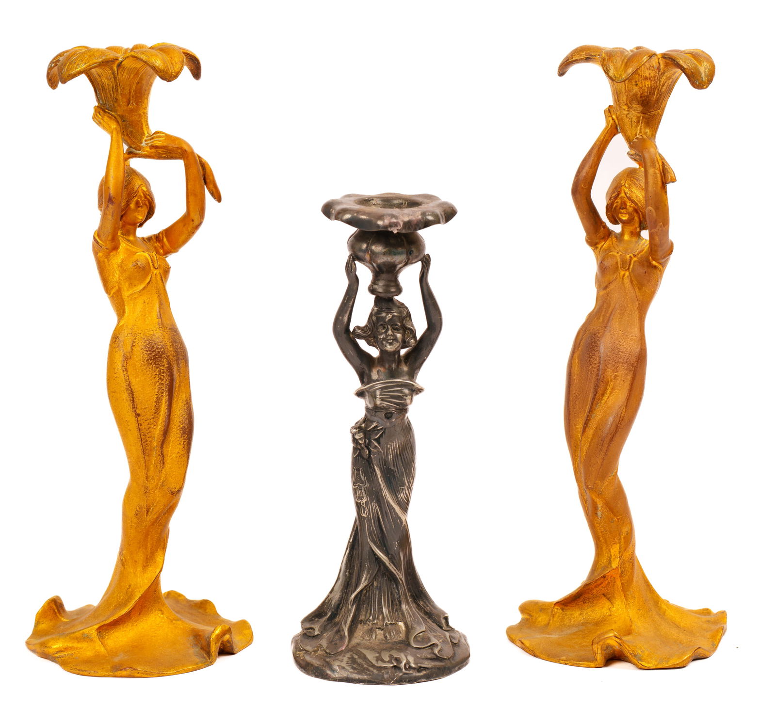 THREE ART NOUVEAU FIGURAL CANDLESTICKS.: A pair, height 12 inches, and a single, height 9 inches.