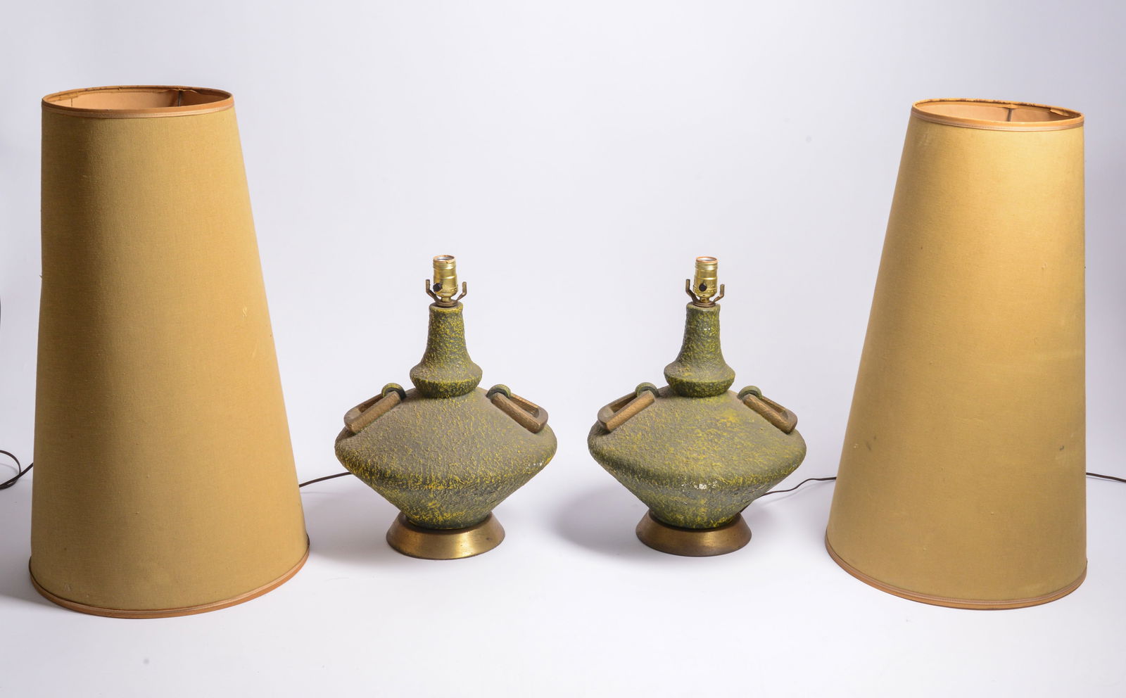 PAIR OF MID CENTURY GREEN CHALKWARE LAMPS.: Height of base 18 inches. With original shades, some staining to shades, lacking harps.